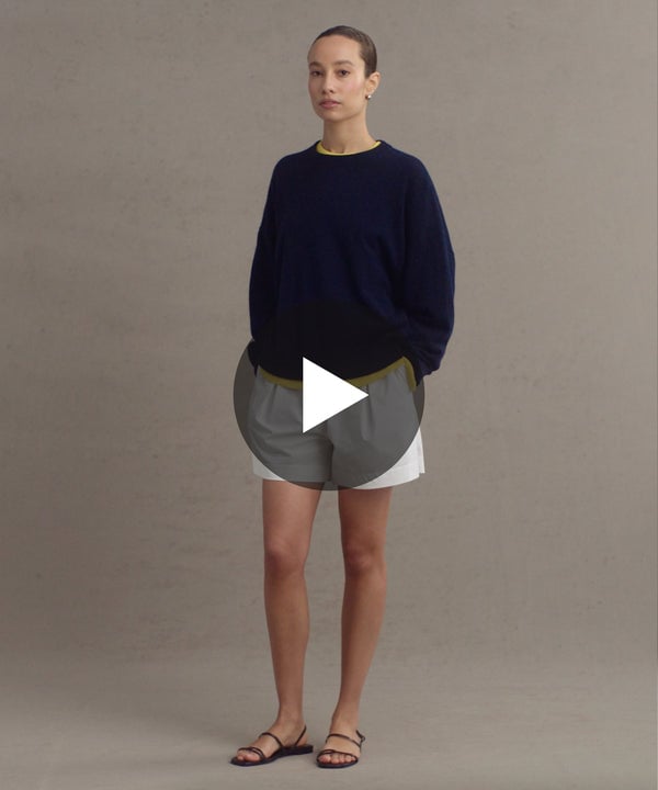 Model wearing Cashmere Marina Crewneck in Dark Navy.
