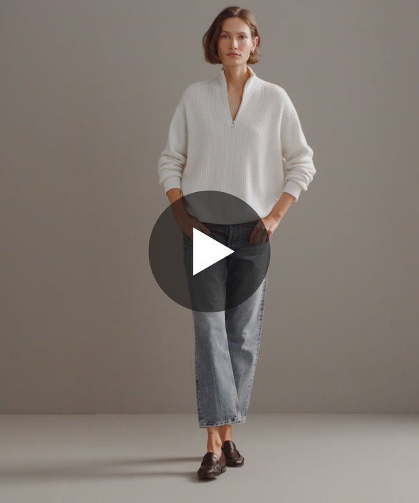 Model walking in-studio wearing Cashmere Half-Zip in Ivory.