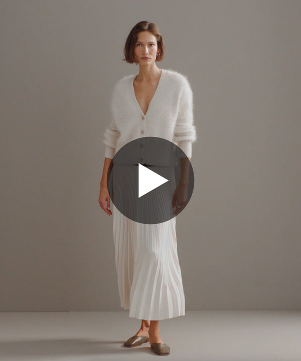 Model walking in-studio wearing Cashmere Peyton Cardigan.