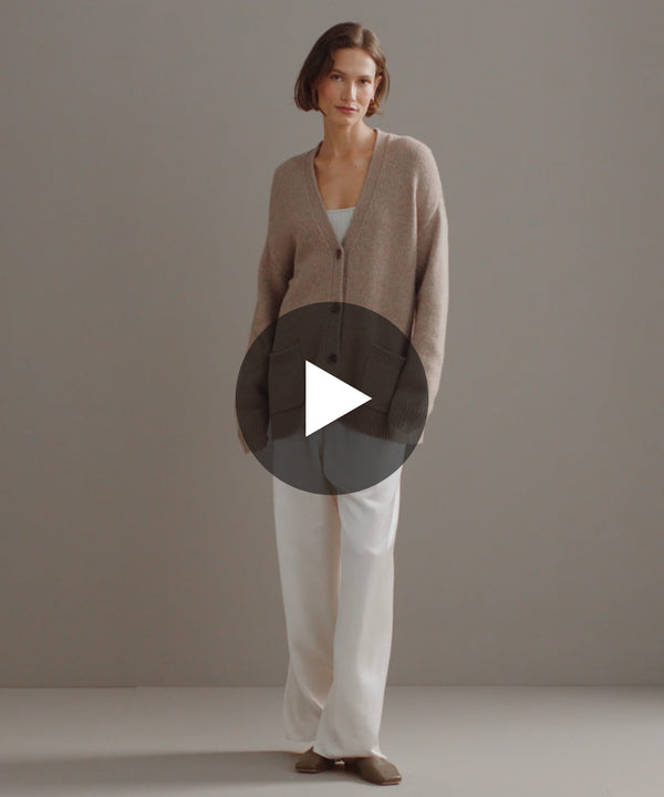 Model walking in-studio wearing Cashmere Spencer Cardigan. 