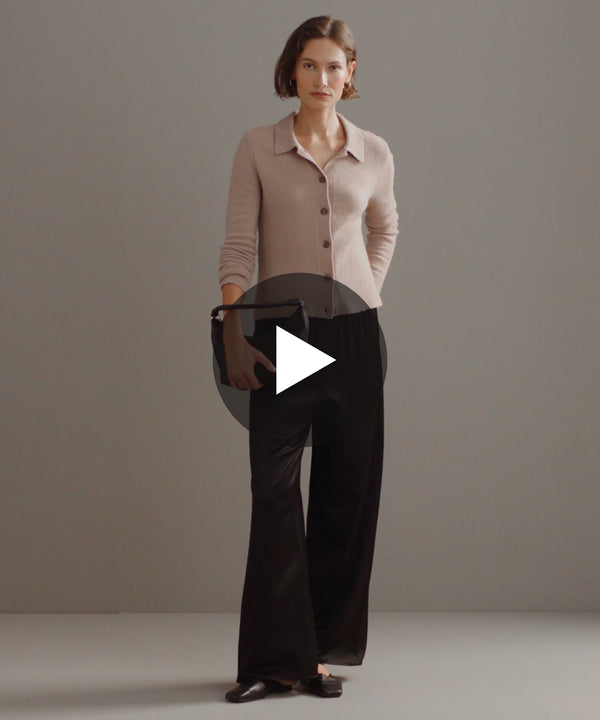Model walking in-studio wearing Demi Pants in Black.